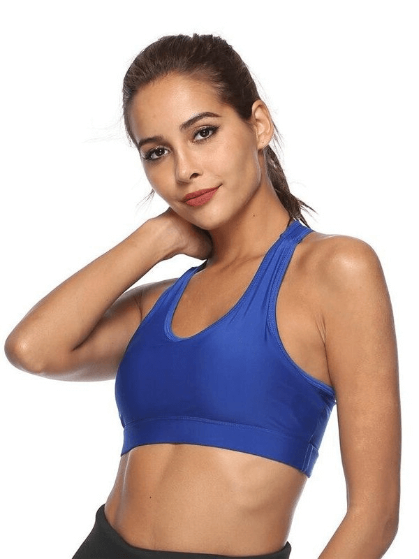 Model wearing stylish blue elastic women's sports bra with back pocket, perfect for fitness, made of breathable polyester.